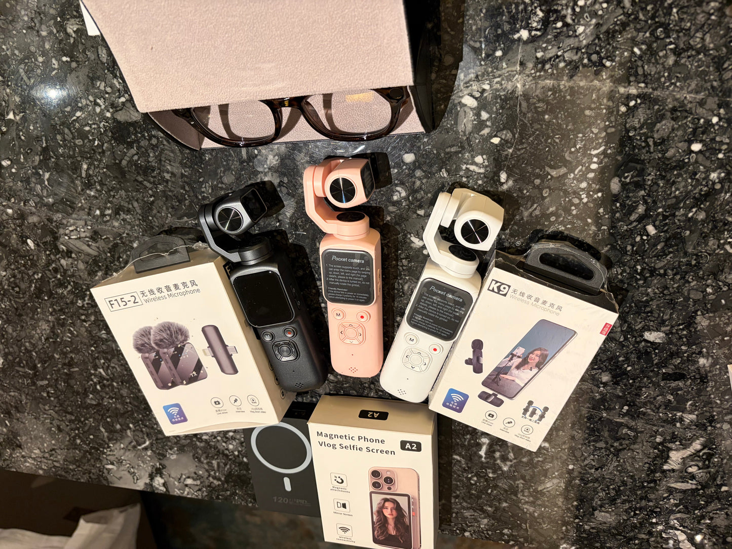 Vlogging bundle 🚨Please Read🚨 1 pair of AI glasses comparable to ray bans
1 pocket camera pink, white or black 1 32gig memory card
1 power bank
Both wireless mics shown
1 phone vlog magnetic selfie screen